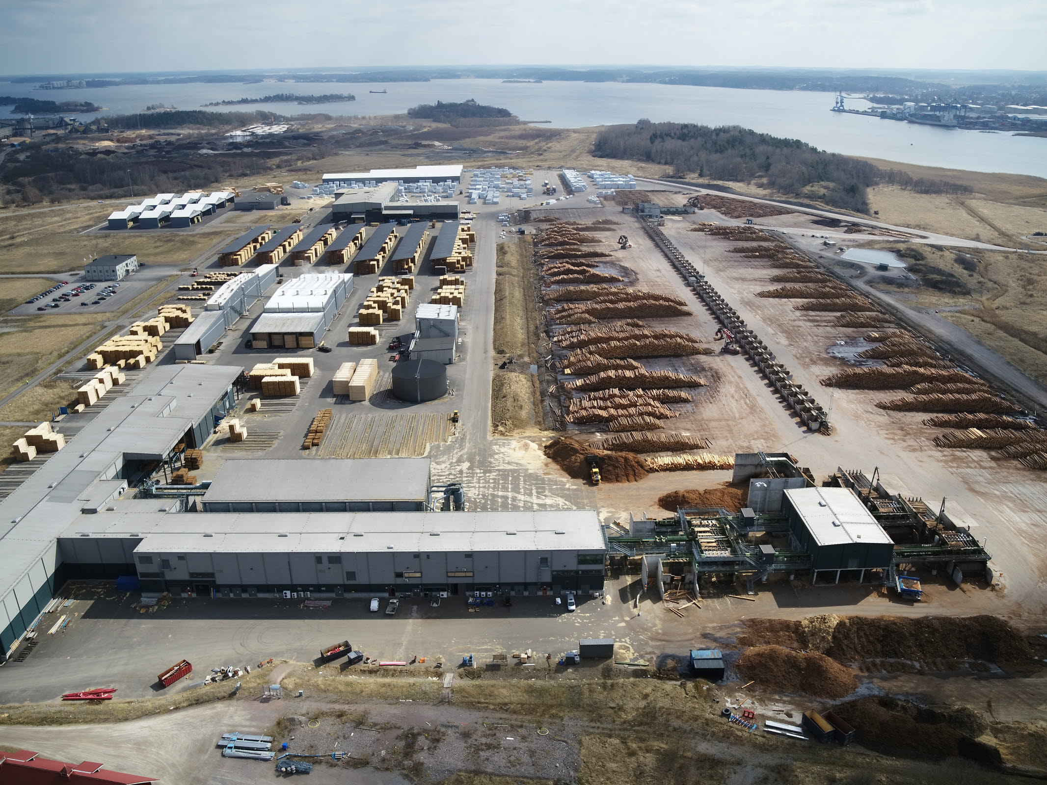 Aerial view of a timber yard, buildings, and stacks of lumber